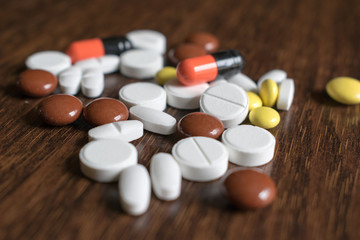 Multicolored tablets. Medical products to maintain good health and well-being.