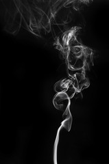 Obraz premium abstract beautiful fragment movement of burn white smoke on black background.