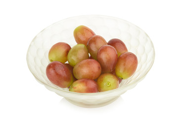 grapes red in bowl glass isolated on white background