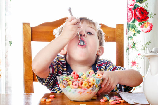 Boy Eating Colorful Breakfast Cereal