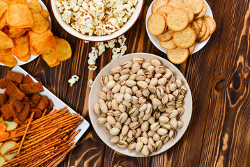 Snacks on a wooden background. Space for text or design.
