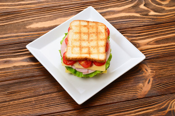 Sandwich bread tomato, lettuce and yellow cheese