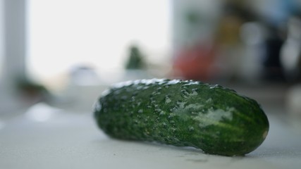 Fresh Tasty Green Cucumber on Kitchen Table