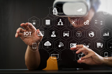 businessman wearing virtual reality goggles in modern office with Smartphone using with VR headset