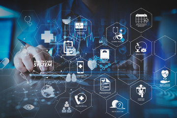 smart doctor hand working with modern laptop computer in modern office with virtual icon diagram
