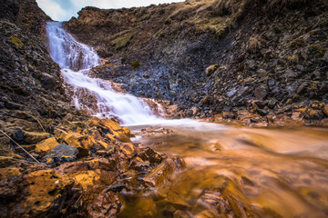 Hvitserkur - May 08, 2018: Waterfall at Hvitserkur, Iceland