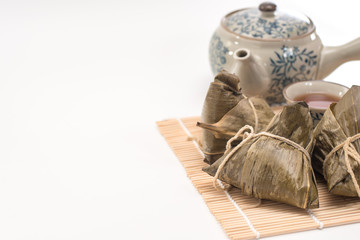 Zongzi - Traditional Dragon Boat Festival dumpling. Hand drawn watercolor painting isolated on white background.