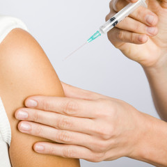 putting an injection in the arm