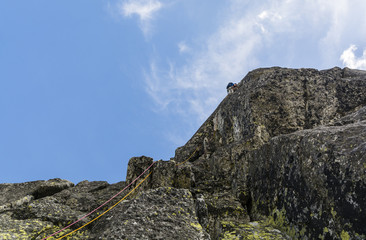 Climber on a vertical rock.