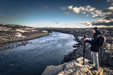 Fototapeta premium Selfoss waterfall- May 06, 2018: Traveler in Selfoss waterfall, Iceland