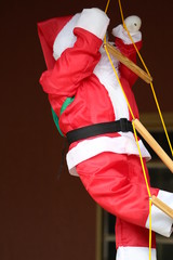 papai noel subindo a escada