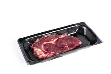 Raw steak in plastic pack.