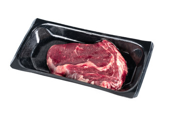 Raw steak in plastic pack.