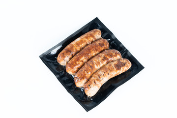 The grill sausages in plastic pack.