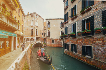Fototapeta na wymiar Canal with gondolas in Venice, Italy.