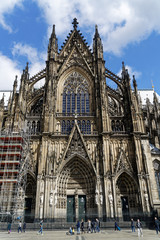Fototapeta na wymiar The southern portal of the Cathedral at Cologne, Germany as three entrances: To the left is the portal of St. Ursula, in the middle the passion portal and to the right is the portal of St. Gereon.