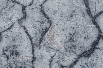Fragment of stone texture with scratches and cracks. Natural Background.