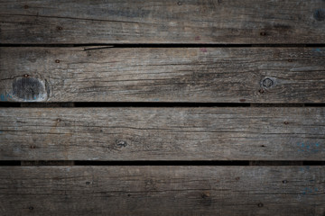 Fototapeta premium Natural grey burn out aged wood background texture. horizontal. vignette