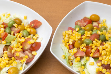 two bowls with salad