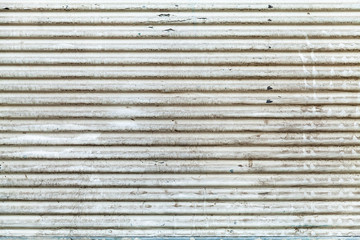 Old white grungy corrugated metal wall