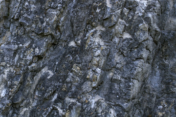 Old stone wall as a background or texture.  Style design.  Abstract background photo. Stone wall surface . Close up.