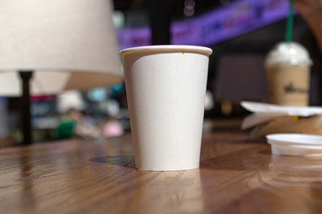 white glass mockap in a cafe background