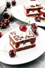 Chocolate cake with cherries and whipped cream. Black Forest cake