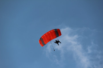 The paratrooper descends to the ground