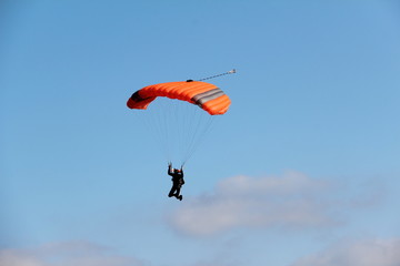 The paratrooper descends to the ground