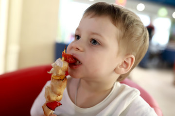 Boy has chiken kebab