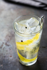 Gin and tonic alcohol cocktail drink with ice in glass