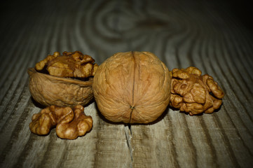 Open walnut on the background of wood