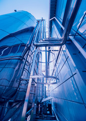 Naklejka premium The tank with water, carbon and ladder. Equipment for beverages factory.