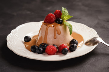 Chocolate pannacotta with raspberries and blueberries.
