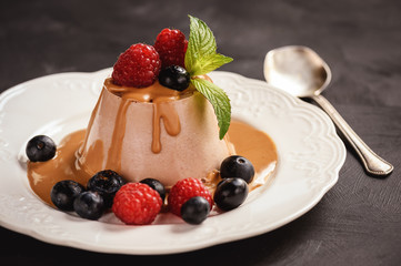 Chocolate pannacotta with raspberries and blueberries.