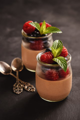 Chocolate pannacotta with raspberries and blueberries.