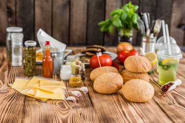 Tasty hamburger with meat and vegetables against a dark background. Fast food. It can be used as a background