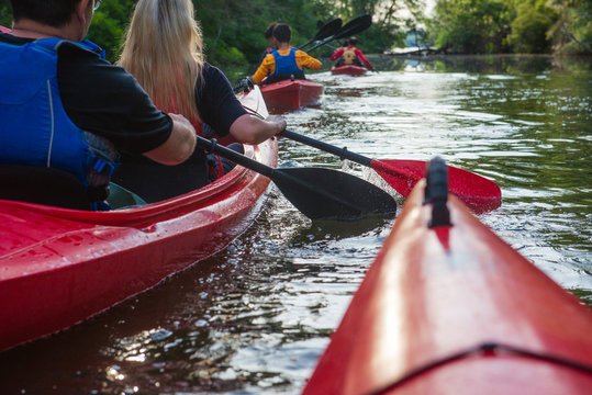 People in kayaks on the river