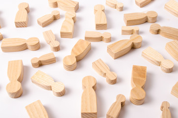 Wooden figures of people are lying on a white background. The concept of human resources management. Headhunters. Search for people to work. The search for the second half. Social network. Business
