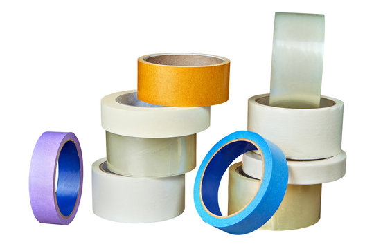 Multicolored duct tape in assortment folded of pile on white.
