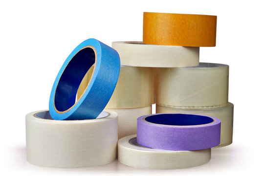 Adhesive tape in assortment, white background.