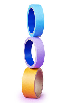 Tower built of three  poised multi-colored rolls of adhesive tape.