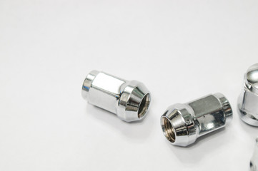 Car service, nut of fixture of a wheel of the car on a white background,