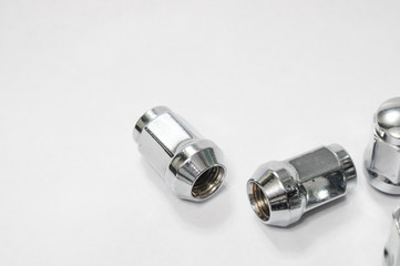 Car service, nut of fixture of a wheel of the car on a white background,