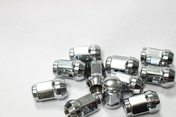 Car service, nut of fixture of a wheel of the car on a white background,