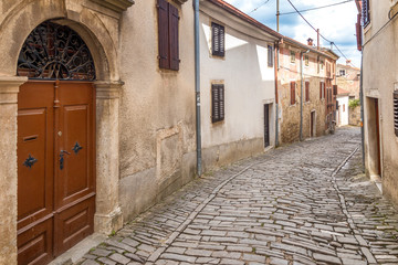 Fototapeta na wymiar An ancient stone street in the city of Motovun on Istria in Croatia, Europe.