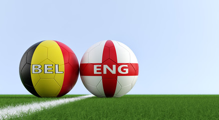 England vs. Belgium Soccer Match - Soccer balls in Englands and Belgian national colors on a soccer field. Copy space on the right side - 3D Rendering 