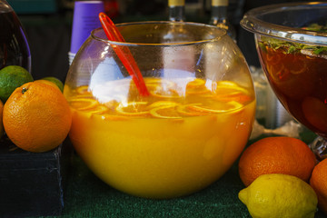 Local Food Festival. Large bowls of fresh lemonade and fruit