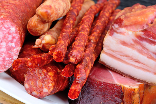 Different types of sausages in a plate on table