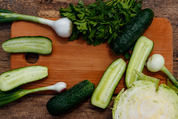 Ingredients for spring vegetable salad on rustic wooden table
